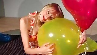 Sexy blonde destroy yellow balloon